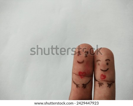 painted finger love concept happy loving couple staying together smiley on red background valentine's day theme hd ultra hd hi-res stock image photo picture selective focus on horizontal background 