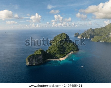 White sand beach with boats in Helicopter Island. El Nido, Palawan. Philippines. Royalty-Free Stock Photo #2429455491