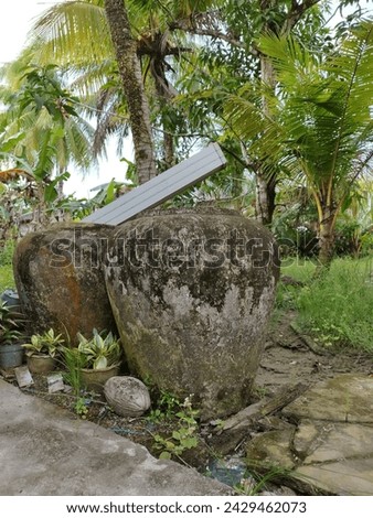 Old cement water tank for home use to collect rainwater.