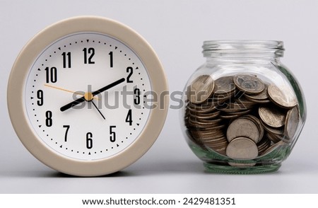 Saving coins in a glass jar, savings concept, financial planning and investment Cash flow and income