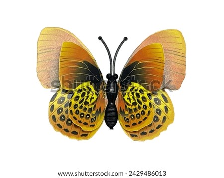 One colourful yellow brown butterfly on a white background. Insect artificial butterfly made of plastic on a white background
