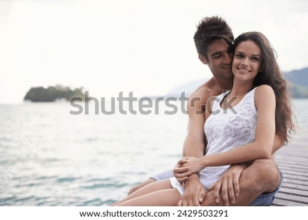 Love, smile and couple at ocean on vacation, holiday or travel together outdoor at pier. Romance, man and happy woman at sea for adventure, care and connection in summer by water in nature on mockup Royalty-Free Stock Photo #2429503291