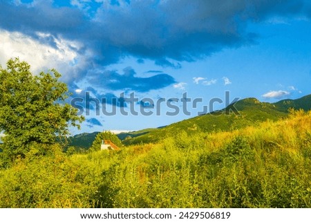 Dramatic rainy clouds in the sky and the approaching rain over summer pastoral landscape .Picture taken on July 11 2014,Krichim town,Plovdiv district Bulgaria