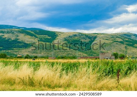 Beautiful skies with white clouds over summer rural landscape,fields .Picture taken on July 11,2014 in the vicinity of Krichim town in the foot of Rhodopes mountains,Bulgaria