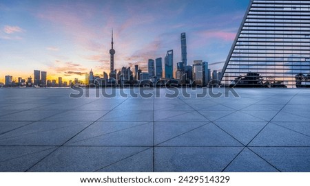 Empty square floor and city skyline with modern buildings scenery at sunrise in Shanghai