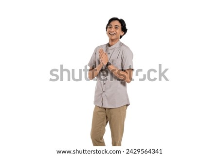 happy asian muslim man greeting gesture celebration Ramadan and ied Mubarak. on isolated background Royalty-Free Stock Photo #2429564341