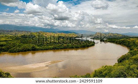 Beautiful valley where you cross the beautiful Magdalena river in the day in Huila - Colombia Royalty-Free Stock Photo #2429591109