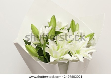 a fragment of white lilies ' bunch on a white background.