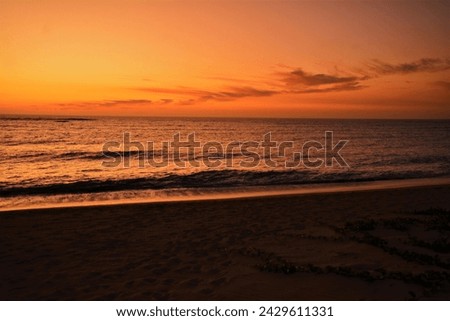 Sunset on a sandy beach in Anakao (35 km south of Toliara, southwest coast of Madagascar) Royalty-Free Stock Photo #2429611331