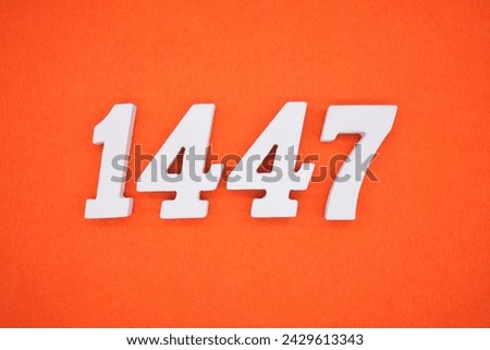Orange felt is the background. The numbers 1447 are made from white painted wood.