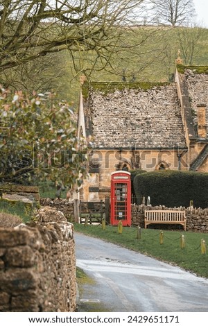 Beautiful Cottages  with Red K6 Phone Box in Snowshill Manor Village, Broadway, The Cotswolds, Gloucestershire Royalty-Free Stock Photo #2429651171