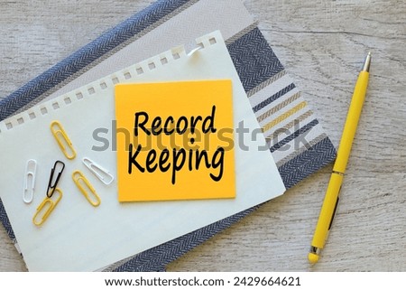 record keeping text on yellow paper for notes on a notepad Royalty-Free Stock Photo #2429664621