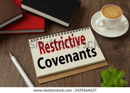 Restrictive Covenants working environment with notepad and cup of coffee. words Royalty-Free Stock Photo #2429664627