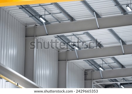 LED lighting motion sensor in an industrial hall Royalty-Free Stock Photo #2429665353