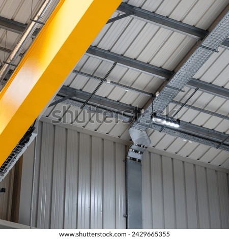 LED lighting motion sensor in an industrial hall Royalty-Free Stock Photo #2429665355