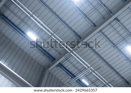LED lighting motion sensor in an industrial hall Royalty-Free Stock Photo #2429665357