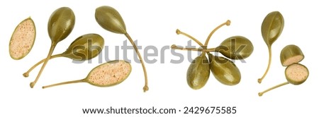 Capers isolated on white background. Pickled or canned capers. Top view. Flat lay Royalty-Free Stock Photo #2429675585