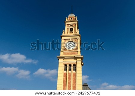 The traditional clock in the Luz station tower, on the terrace of the building that houses the Portuguese language museum, in the city of São Paulo Royalty-Free Stock Photo #2429677491