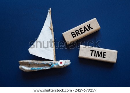 Break Time symbol. Concept word Break Time on wooden blocks. Beautiful deep blue background with boat. Business and Break Time concept. Copy space