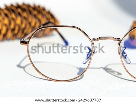These elegant gold-framed glasses offer a touch of class and sophistication to any stock photography.