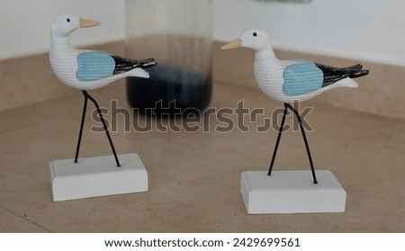 Close-up image of two beautiful seagulls decorations with a background