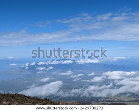view of clouds below on volcano in haleakalā national park