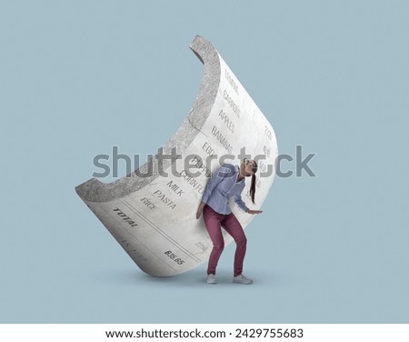Worried stressed woman crushed by a big heavy grocery receipt, inflation and budgeting concept Royalty-Free Stock Photo #2429755683