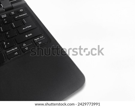 The keyboard of a laptop is black