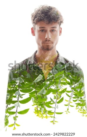 A double exposure male portrait merged with green shoots at the bottom