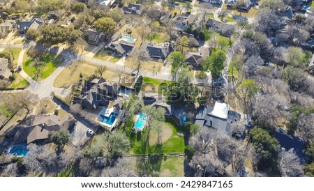 Low density housing upscale neighborhood, aerial view suburban houses with circular driveway, swimming pool, large backyard, residential single family homes, expensive area Dallas, Texas, USA. Winter Royalty-Free Stock Photo #2429847165