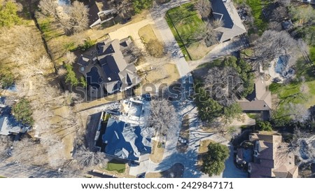Aerial view upscale two story house with circular driveway, swimming pool, large backyard, suburban low density housing small number residential single family homes, expensive area Dallas, Texas. USA Royalty-Free Stock Photo #2429847171