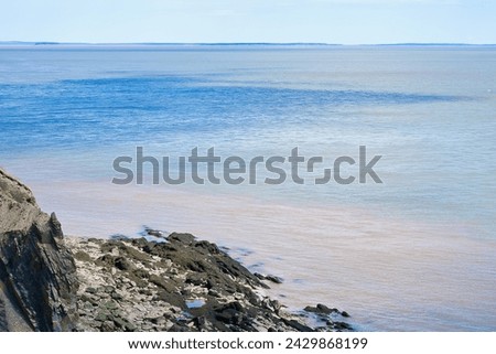 Colorful sea water at Cape Enrage NB Canada  Royalty-Free Stock Photo #2429868199