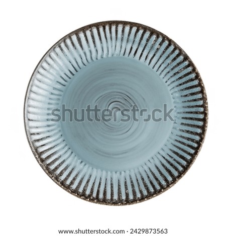 Trendy Circle Old Vintage blue sand grain texture handmade Ceramic Dish plate, top view stoneware plate isolated white.  Royalty-Free Stock Photo #2429873563