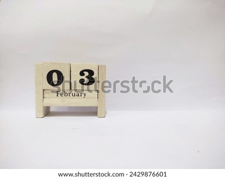 03 February wooden calendar in white background