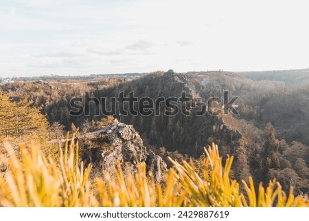 Mountainous and rocky environment of the Divoka Sarka valley in the northern part of Prague during sunset. The beauty of the capital of the Czech Republic.