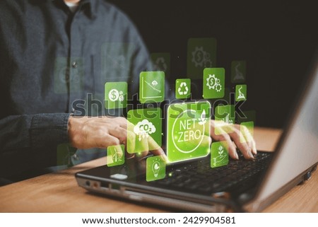 Carbon credit green factory technology concept. Man-laptop to trade tax fund exchange on virtual screen. Carbon etf to invest in sustainable business. Carbon CO2 offset. Net zero emission. Esg change