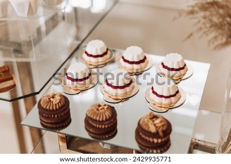 Almond cookies, sweet cakes for a wedding banquet. A delicious reception, a luxurious ceremony. Table with sweets and desserts. Delicious colorful French desserts on a plate or table. Candy bar.