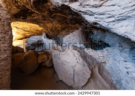 Walking inside Gila Cliff Dwellings caves. New Mexico, USA. Royalty-Free Stock Photo #2429947301