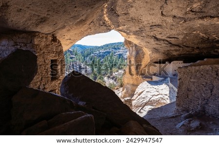 Walking inside Gila Cliff Dwellings caves. New Mexico, USA. Royalty-Free Stock Photo #2429947547