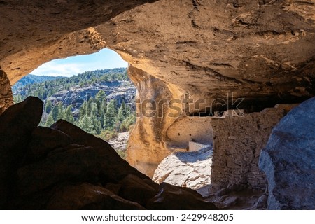 Walking inside Gila Cliff Dwellings caves. New Mexico, USA. Royalty-Free Stock Photo #2429948205