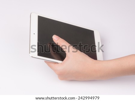Women hand with tablet isolated on white background