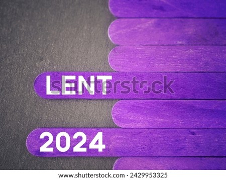 Lent Season,Holy Week and Good Friday Concepts. Lent 2024 text on purple wooden sticks background. Stock photo.