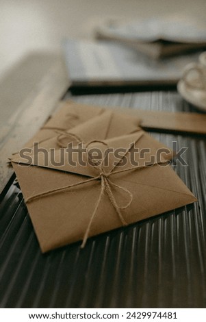 
beautiful beige gift envelope tied with rope