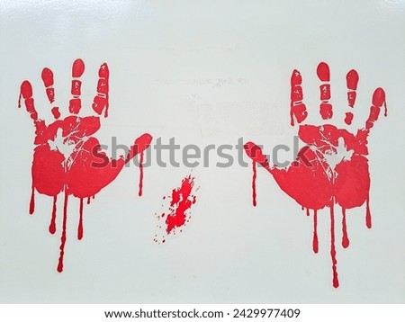 Red watercolor print of human hand on white background isolated close up Royalty-Free Stock Photo #2429977409