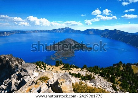 Panoramic view of Crater Lake - the main feature of Crater Lake National Park, the lake partly fills a caldera formed by the collapse of the volcano Mt. Mazama (south-central Oregon, western USA) Royalty-Free Stock Photo #2429981773