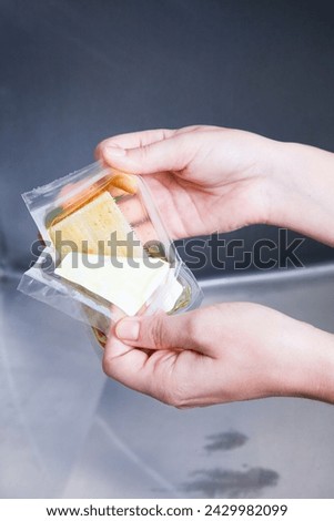 Surgeon having his hands surgically washed. A Caucasian doctor dressed in his right-hand profile with his hands full of foam and dressed in his surgical uniform.	 Royalty-Free Stock Photo #2429982099