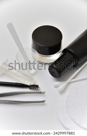 Set of makeup kit for eyebrows with henna and cosmetic professional tool on white background