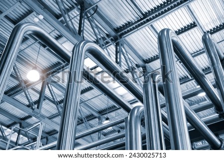 Stainless steel pipes in food or pharmaceutical or chemical industrial factory, industrial concept background Royalty-Free Stock Photo #2430025713