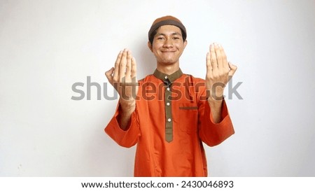 Asian Muslim man praying gesture on white background