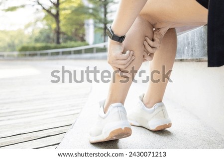 Exercise Associated Muscle Cramps,woman suffering from calf pain,muscular spasms and cramps or Achilles tendinitis,damage to muscles and tendons in calf of the leg,pain in Gastrocnemius and Soleus Royalty-Free Stock Photo #2430071213
